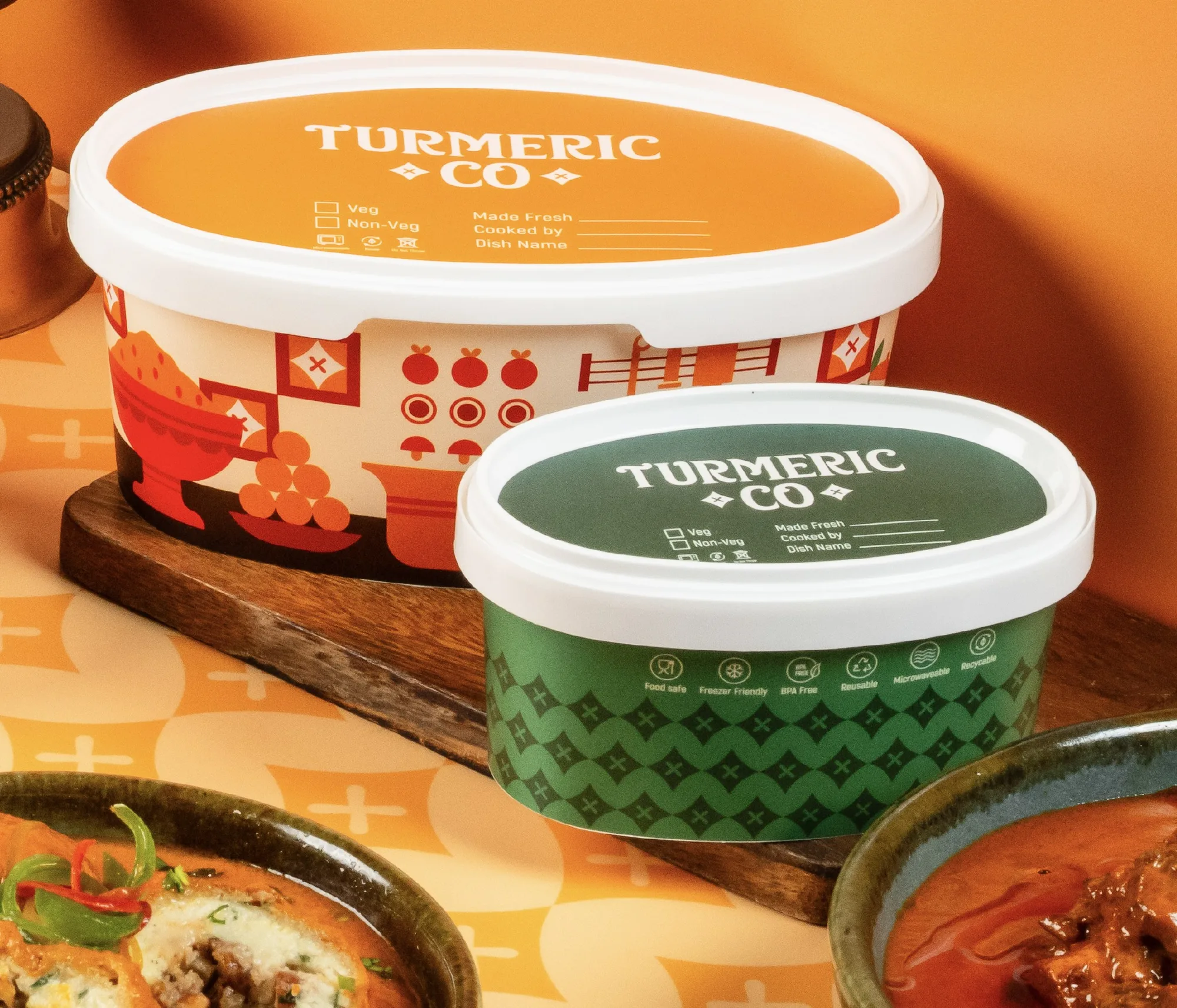 Turmeric Co. tubs on a wooden board — food-safe, reusable packaging sealed for delivery